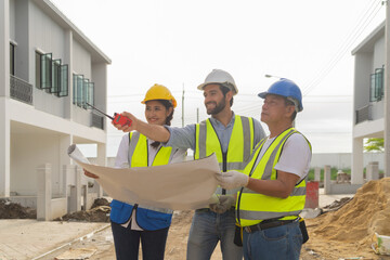 A group of workers, a designer team talk, communicate, discuss, and working on industrial construction site at home architecture building project. People lifestyle.