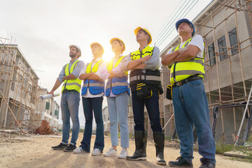 A group of workers, a designer team talk, communicate, discuss, and working on industrial...