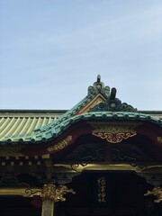 The beautiful rooftop detail of the ancient shrine of Japan, “Nezu shrine” year 2022 on a sunny day May 20th, downtown Tokyo Japan