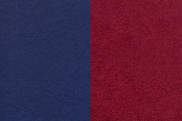 Fototapeta premium Texture of craft navy blue and dasrk red paper background, half two colors, macro. Structure of wine craft cardboard.