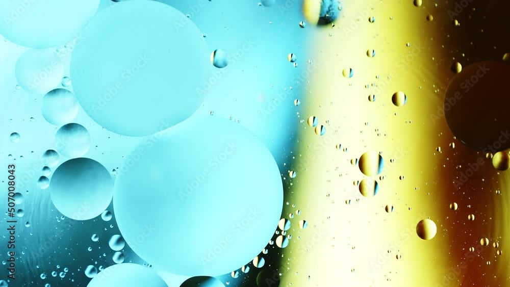 Poster real abstract colourful oil drops in water rotation with color gradient mixing background.