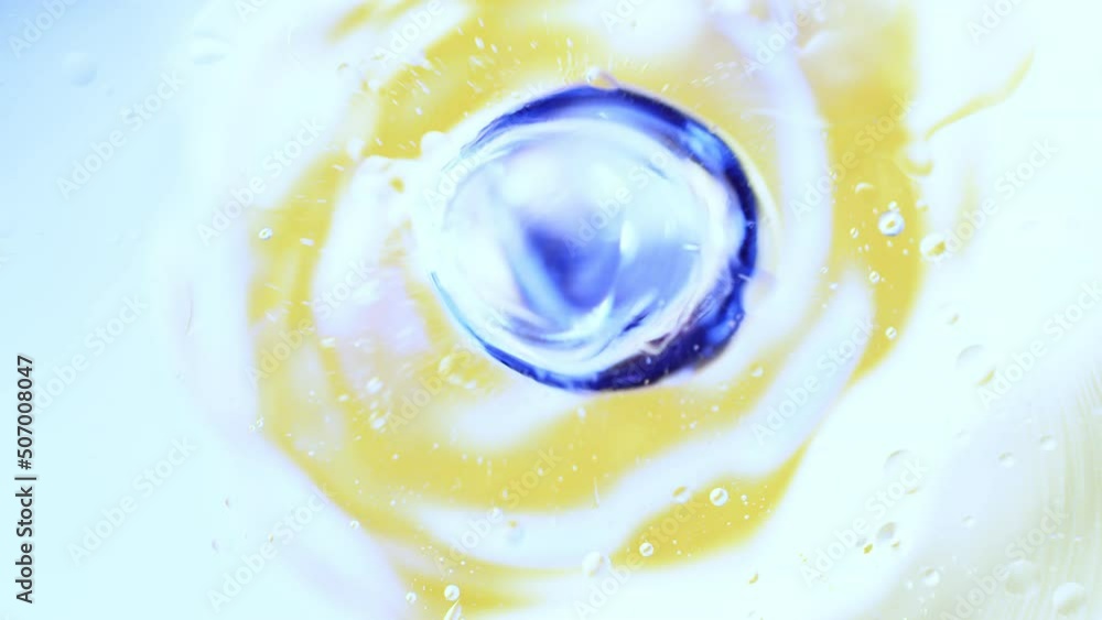 Poster real abstract colourful oil drops in water rotation with color gradient mixing background.