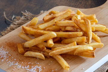 pile of fresh French fries with salt