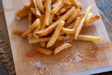 pile of fresh French fries with salt
