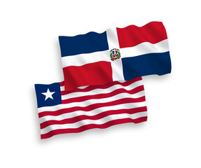 National vector fabric wave flags of Dominican Republic and Liberia isolated on white background. 1 to 2 proportion.