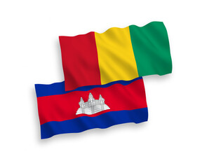 National vector fabric wave flags of Kingdom of Cambodia and Guinea isolated on white background. 1 to 2 proportion.