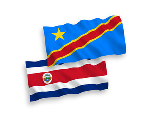 National vector fabric wave flags of Republic of Costa Rica and Democratic Republic of the Congo isolated on white background. 1 to 2 proportion.