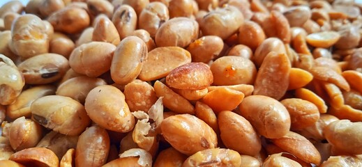 Fried salted peanut snack. Food and beverage advertising background. Suitable for promoting the food and drink company and industry.