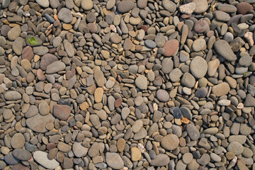 海岸沿いの小石の背景素材