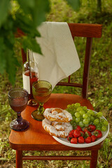 Summer outdoor junket. Cheese, croissant and berries at outdoor