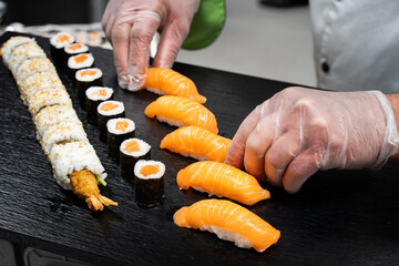 The chef presents his sushi delicacy. Prepare sushi.
