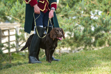 view of a hunting dog and his master during a hunt