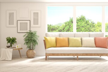Fototapeta premium White living room with sofa and summer landscape in window. Scandinavian interior design. 3D illustration