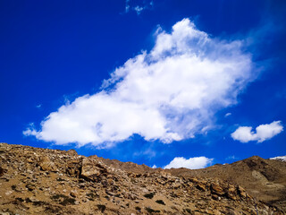 Clouds over the stone landscape with blue sky