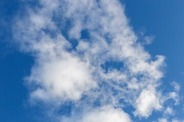 White clouds in the blue sky. Sky background.