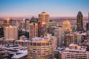Montreal, Qc, Canada - January 8th 2021: View on Montreal skyscrapers and downtown buildings at sunset from the Kondiaronk belvedere, on top of Mount Royal (Quebec, Canada)