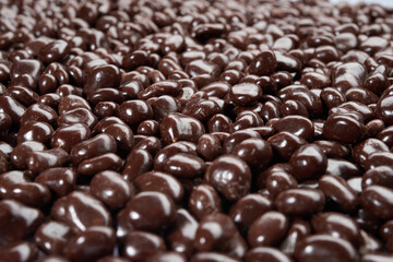 Chocolate candy texture. Sweets candy. Milk stone chocolate Candy Pebbles Top view background texture. 