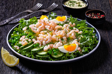 pink cocktail shrimps salad with veggies and eggs