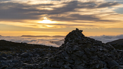 Mountain summit landscape view with cloud inversion weather at sunrise