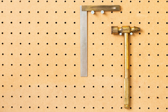 Hand Tools On A Workshop Peg Board.