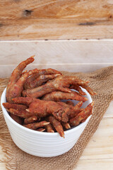 South African township delicacy,  fried chicken feet or walkie talkies with onion and sauce