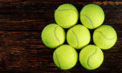 Tennis balls on wooden background, sport concept, rustic style, stock photo, space for text