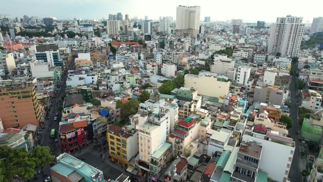 low altitude aerial of the city skyline in district one of Ho Chi Minh City (Saigon) Vietnam with residential buildings densely populated on a sunny afternoon.