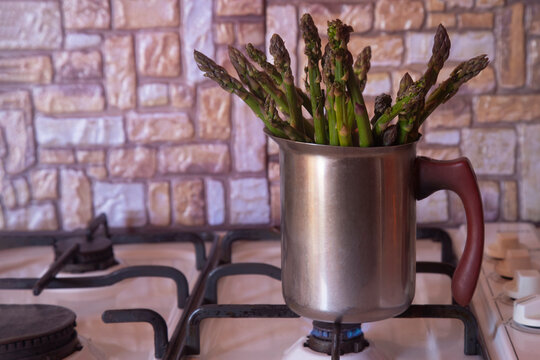 Cooking Asparagus In A Small Saucepan At Home