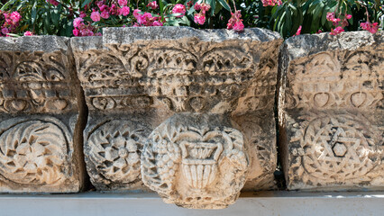 Close up of an urn carving at the ruins of Capernaum in Israel other names Kfar Nahum or...