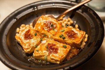 Pan-fried Hakka Style Stuffed Tofu in ceramic bowl. Traditional Hakka cuisine in southern china.