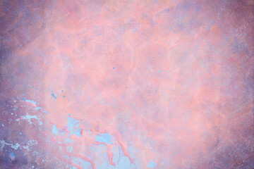 Pink crumpled paper texture with grainy blue splatter. Damage varies from small dots to larger worn out areas that reveal the underlying blue color.