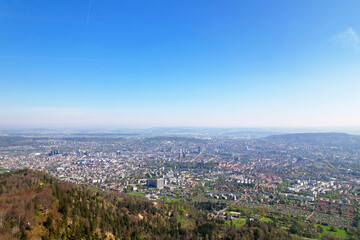 Aerial view over City of Zürich seen from local mountain Uetliberg on a sunny spring day. Photo taken April 21st, 2022, Zurich, Switzerland.