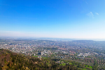 Aerial view over City of Zürich on a beautiful spring day with blue cloudy sky background. Photo taken April 21st, 2022, Zurich, Switzerland.