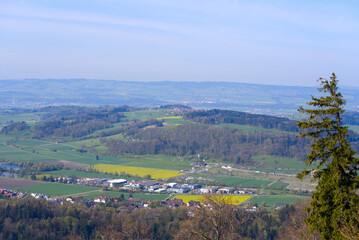 Obraz premium Aerial view over rural landscape seen from local mountain Uetliberg on a blue cloudy spring day. Photo taken April 21st, 2022, Zurich, Switzerland.