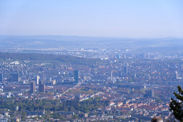 Fototapeta na wymiar Aerial view over City of Zürich on a beautiful spring day with blue cloudy sky background. Photo taken April 21st, 2022, Zurich, Switzerland.