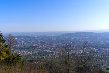 Aerial view over City of Zürich on a beautiful spring day with blue cloudy sky background. Photo taken April 21st, 2022, Zurich, Switzerland.