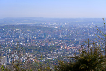 Fototapeta na wymiar Aerial view over City of Zürich on a beautiful spring day with blue cloudy sky background. Photo taken April 21st, 2022, Zurich, Switzerland.