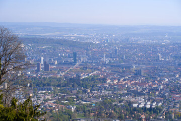 Aerial view over City of Zürich on a beautiful spring day with blue cloudy sky background. Photo taken April 21st, 2022, Zurich, Switzerland.