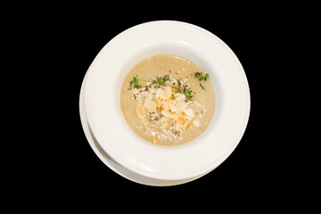 Top view of pumpkin Soup with Almonds.