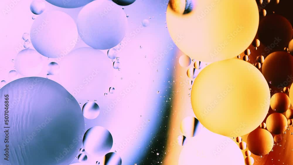 Poster real abstract colourful oil drops in water rotation with color gradient mixing background.