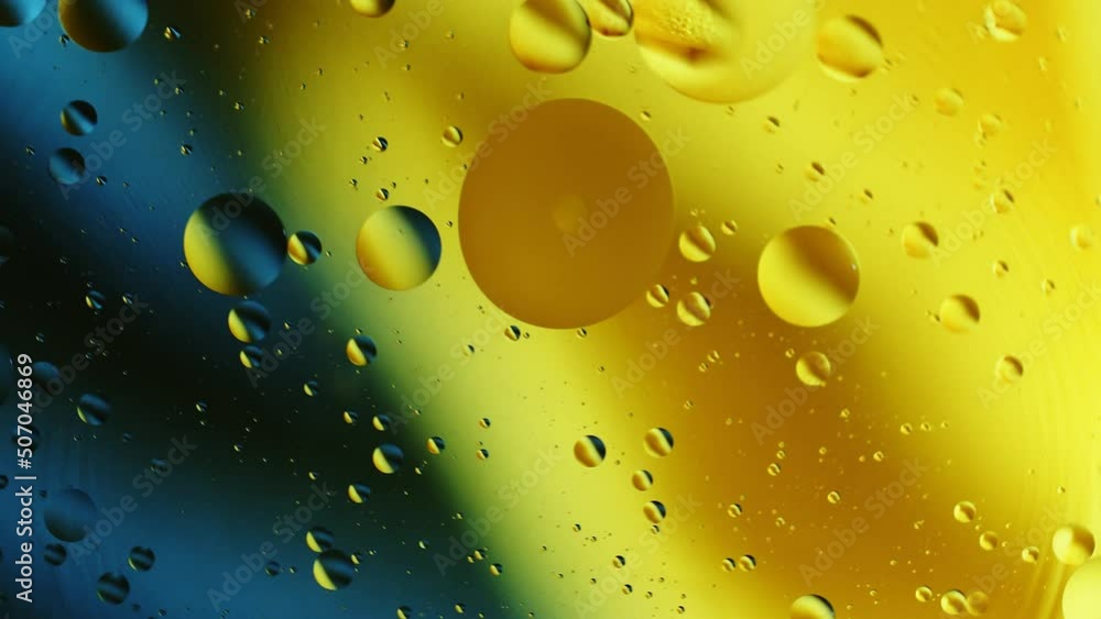 Poster real abstract colourful oil drops in water rotation with color gradient mixing background.