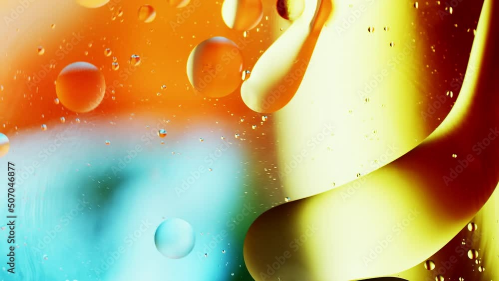 Poster real close up oil bubbles in water rotation with color gradient abstract mixing background.