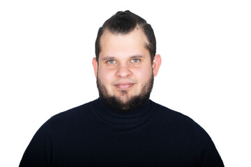 Young latin man headshot over white background. He has a bear, pony tail, green eyes. He is wearing a turtle neck pullover and is smiling - obrazy, fototapety, plakaty