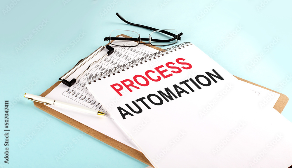 Poster process automation text on notepad on clipboard with chart on blue background, concept closeup. busi