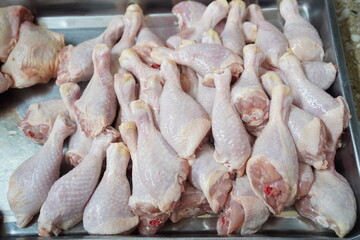Almaty, Kazakhstan - 03.25.2022 : Chilled chicken legs laid out for sale in a hypermarket