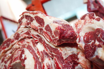 Almaty, Kazakhstan - 03.25.2022 : Different parts of meat are prepared for sale on the open market.