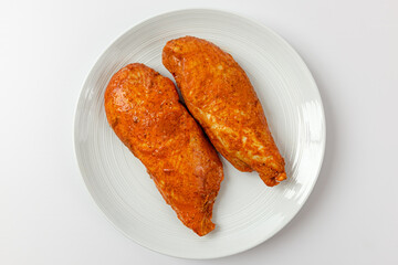 Tandoori chicken breast on white background
