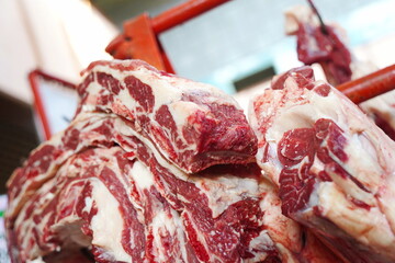 Almaty, Kazakhstan - 03.25.2022 : Different parts of meat are prepared for sale on the open market.