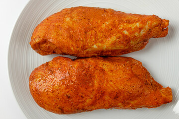 Tandoori chicken breast on white background
