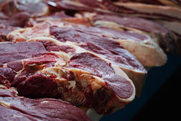 Almaty, Kazakhstan - 03.25.2022 : Different parts of meat are prepared for sale on the open market.